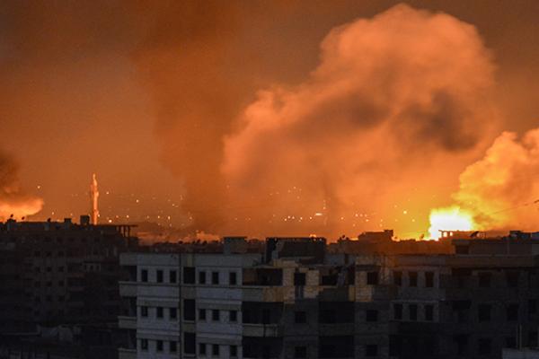 April 28, 2018 explosions appearing in the skyline of a southern district of the Syrian capital Damascus, during regime strikes targeting the Islamic State group in the Palestinian camp of Yarmuk, and neighbouring districts.