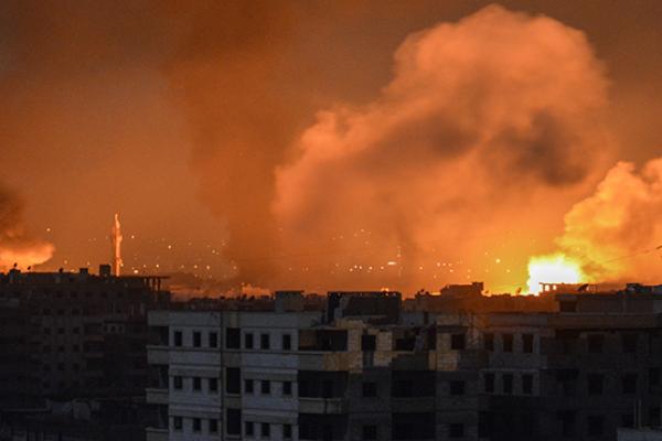 April 28, 2018 explosions appearing in the skyline of a southern district of the Syrian capital Damascus, during regime strikes targeting the Islamic State group in the Palestinian camp of Yarmuk, and neighbouring districts.