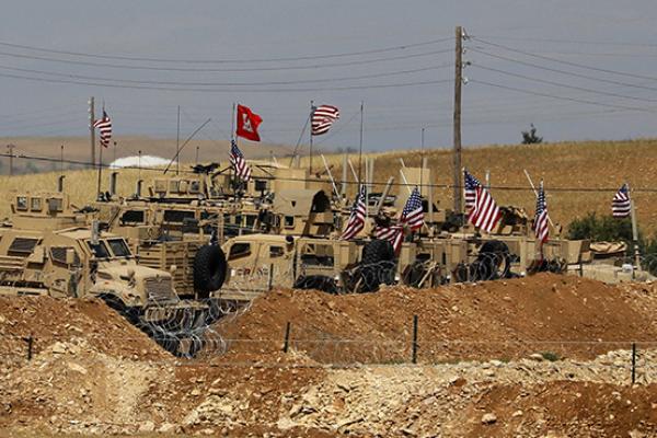 Vehicles belonging to US-backed coalition forces in the northern Syrian town of Manbij, May 8, 2018 (DELIL SOULEIMAN/AFP/Getty Images)