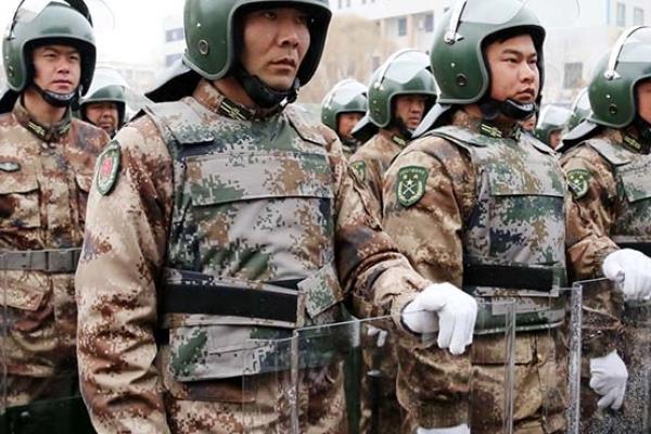 Officers and soldiers of Xinjiang Production and Construction Corps attend a pep rally for the anti-terrorism and maintaining stability at Shuanghe in Xinjiang Uighur Autonomous Region of China. (Photo by VCG/VCG via Getty Images)