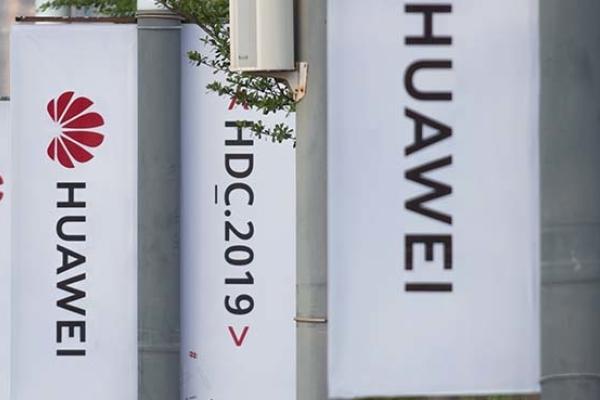 Banners with the Huawei logo are seen outside the venue where the telecom giant unveiled its new HarmonyOS operating system in Dongguan, Guangdong province. (Getty Image)