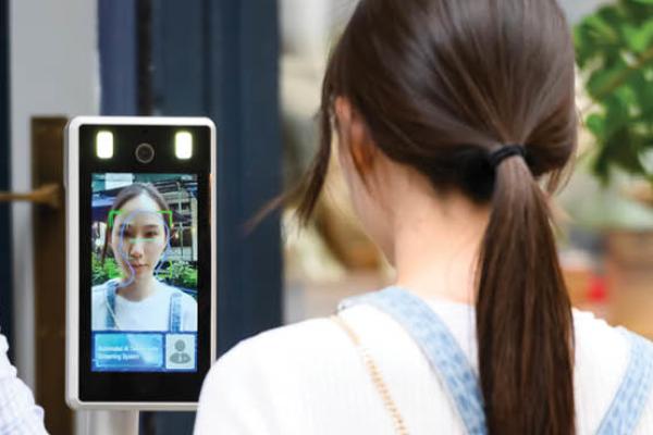 A person gets checked by an automated AI temperature screening system outside a restaurant as the city continues Phase 4 of re-opening following restrictions imposed to slow the spread of coronavirus on August 22, 2020, in New York City. (Getty Images)