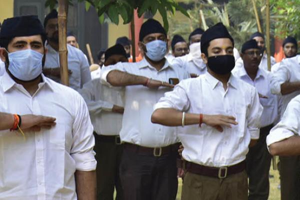 Rashtriya Swayamsevak Sangh (RSS) volunteers perform a salute towards the RSS flag during Shastra Puja ceremony (weapon worship) on the occasion of Vijayadashmi, on October 25, 2020, in Amritsar, India. (Getty Images)