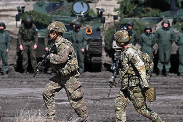 Troops from the Polish 18th Mechanised Division and the 82nd Airborne Division (USA) take part in tactical and fire training on April 8, 2022 in Nowa Deba, Poland. (Getty Images)