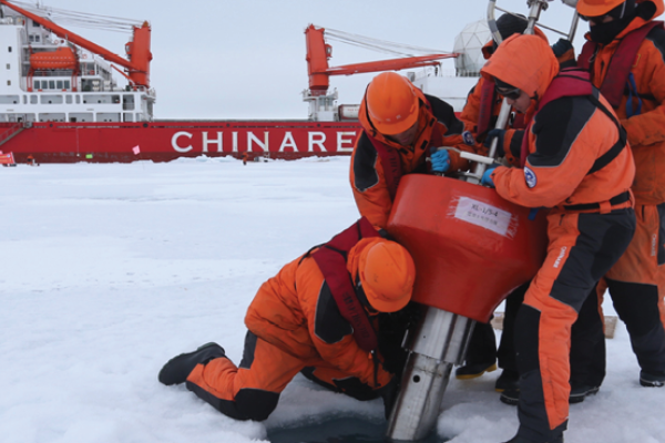 Members of China's research team set up an ocean profiling float at a short-term data acquisition location near the icebreaker Xuelong, or "Snow Dragon," in the Arctic Ocean, on August 18, 2016. (Xinhua/Wu Yue via Getty Images) 