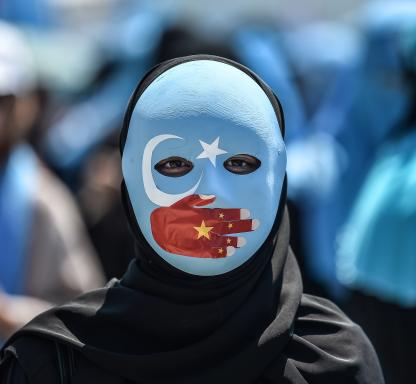 uyghur protestor with mask