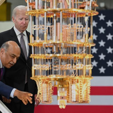 US President Joe Biden looks at a quantum computer with IBM CEO Arvind Krishna as he tours the IBM facility in Poughkeepsie, New York on October 6, 2022. 