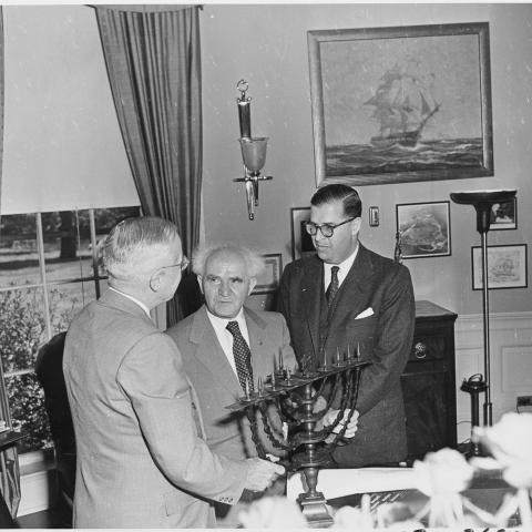 resident Truman in the Oval Office, evidently receiving a Menorah as a gift from the Prime Minister of israel david ben gurion