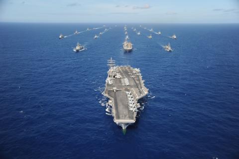 The Nimitz-class aircraft carrier USS Ronald Reagan leads a mass formation of ships from Korea, Taiwan, Japan, Singapore, France, Canada, Australia and the U.S. during Rim of the Pacific 2010. RIMPAC is the