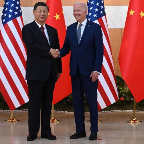 Joe Biden and Xi Jinping shake hands before meeting on the sidelines of the G20 Summit in Bali, Indonesia, on November 14, 2022. (Saul Loeb/AFP via Getty Images)