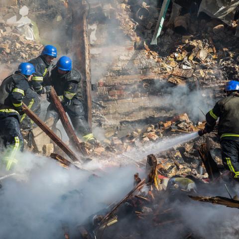 KYIV, UKRAINE - 2022/10/17: Ukrainian rescuers work at the site of a residential building destroyed by a Russian drone strike, which local authorities consider to be Iranian-made unmanned aerial vehicles (UAVs) Shahed-136, in central Kyiv. At least four people have been killed as a result of a drone attack on a residential building in Kyiv. (Photo by Oleksii Chumachenko/SOPA Images/LightRocket via Getty Images)