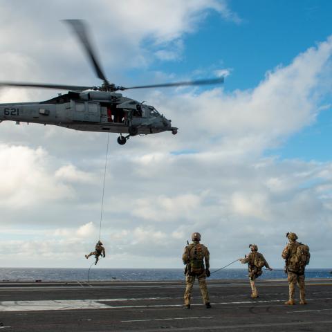 Sailors conduct helicopter rope suspension technique training from an MH-60S Sea Hawk on the flight deck aboard the USS Ronald Reagan in the Philippine Sea on October 29, 2022. (US Navy Photo by Michael B. Jarmiolowski)