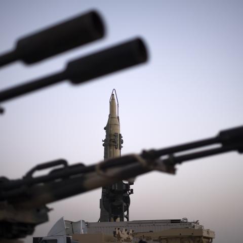 An Iranian long range surface to surface Qadr missile and an anti-aircraft gun are displayed in a war exhibition organized by the Islamic Revolutionary Guard Corps in a park in southern Tehran to mark the anniversary of the Iran-Iraq war on September 23, 2021. (Morteza Nikoubazl/NurPhoto via Getty Images)