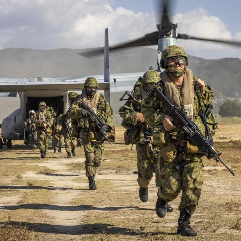Members of the Japan Ground Self-Defense Force (JGSDF) with 7th Company, 3rd Battalion, 1st Airborne Brigade, disembark an MV-22B Osprey assigned to Marine Medium Tiltrotor Squadron (VMM) 265 during Keen Sword 23 at Camp Ainoura, Japan, Nov. 16, 2022. Keen Sword is a biennial training event that exercises the combined capabilities and lethality developed between the 1st Marine Aircraft Wing, III Marine Expeditionary Force, and the Japan Self Defense Force (JSDF). This bilateral field-training exercise betwe