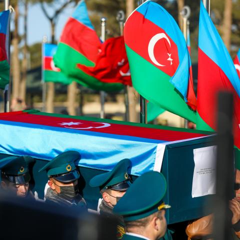 A funeral for 14 Azerbaijani soldiers killed in a helicopter crash held on December 1, 2021, in Baku, Azerbaijan. (Aziz Karimov/Getty Images)