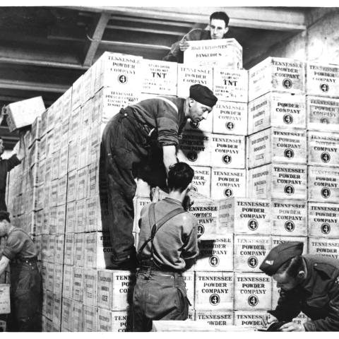 Cases of TNT and gunpowder shipped from the United States under Lend-Lease are stacked in a tunnel in western England dug out of solid rock 100 feet underground. (HUM Images/Universal Images Group via Getty Images)