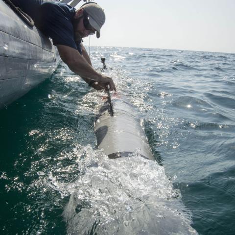 151020-N-JC374-240 ARABIAN GULF (Oct. 20, 2015) Eric Sharp, an unmanned underwater vehicle (UUV) operator assigned to Commander, Task Group (CTG) 56.1, recovers a MK 18 MOD 2 UUV after an operational test. The MK 18 MOD 2 UUV uses side scan sonar to search and discover objects of interest. CTG 56.1 conducts mine countermeasures, explosive ordnance disposal, salvage-diving, and force protection operations throughout the U.S. 5th Fleet area of operations. (U.S. Navy photo by Mass Communication Specialist 3rd 