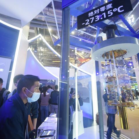Visitors look at Alibaba DAMO Academy’s core components of quantum computer during the Apsara Conference 2021 on October 19, 2021, in Hangzhou, China. (Photo by Long Wei/VCG via Getty Images)
