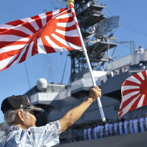 50602-N-IU636-204 PEARL HARBOR (June 2, 2015) A member of the Japanese community in Hawaii welcomes the Japan Maritime Self-Defense Force (JMSDF) ship JS Kashima (TV 3508) as it arrives at Joint Base Pearl Harbor-Hickam. Kashima is joined by JS Yamagiri (DD 152) and JS Shimayuki (TV 3513) for a scheduled port visit. While in Hawaii, JMSDF sailors will participate in wreath-laying ceremonies at the USS Arizona Memorial, National Memorial Cemetery of the Pacific (Punchbowl) and Makiki Cemetery. The JMSDF has 