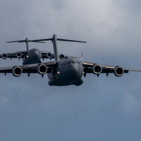 A Royal Australian Air Force C-17 Globemaster III flies in front of a U.S. C-17 during an aerial maneuver training mission around the Hawaiian islands as part of Exercise Global Dexterity 2022 at Joint Base Pearl Harbor-Hickam, Hawaii, May 4, 2022. The RAAF and USAF conducted joint flying missions alongside each other and swapped aircrew members to better learn of each others’ procedures and techniques. (U.S. Air Force photo by Airman 1st Class Makensie Cooper)