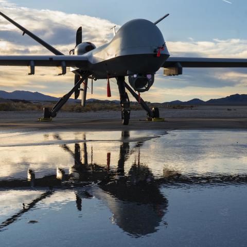 An MQ-9 Reaper is parked on a taxiway during sunset at Creech Air Force Base, Nevada, Nov. 17, 2020. The Reaper is an armed, multi-mission, long-endurance Remotely Piloted Aircraft that is managed and flown by Airmen who provide persistent attack and reconnaissance capabilities to keep our nation safe. (U.S. Air Force photo by Senior Airman Haley Stevens)