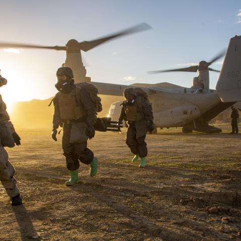 U.S. Marines with 1st Marine Division G-3 Chemical, Biological, Radiological and Nuclear Defense platoon, I Marine Expeditionary Force (MEF), are led to a thorough decontamination station during exercise Steel Knight 23, on Marine Corps Base Camp Pendleton, California, Dec. 7, 2022. 3rd Marine Aircraft Wing (MAW) and 1st Marine Division Marines executed a tactical site exploitation into a potentially contaminated environment. Exercise Steel Knight 23 provides 1st Marine Division and 3rd MAW an opportunity t
