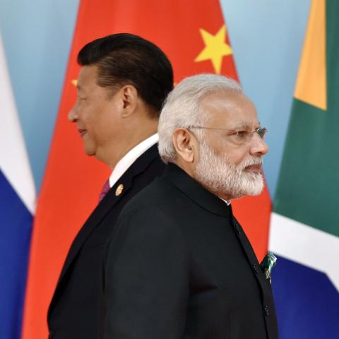 Chinese President Xi Jinping (L) and Indian Prime Minister Narendra Modi attend the group photo session during the BRICS Summit at the Xiamen International Conference and Exhibition Center in Xiamen, southeastern China's Fujian Province on September 4, 2017. Xi opened the annual summit of BRICS leaders that already has been upstaged by North Korea's latest nuclear weapons provocation. / AFP PHOTO / POOL / Kenzaburo FUKUHARA (Photo credit should read KENZABURO FUKUHARA/AFP via Getty Images)