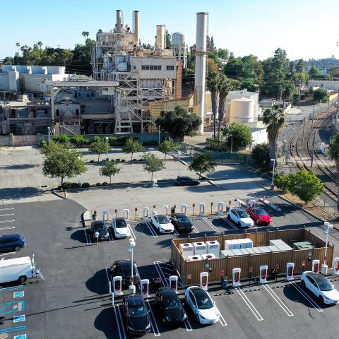 An aerial view of Tesla cars recharging at a Tesla Supercharger station, located next to Pasadena Water and Power on April 14, 2022 in Pasadena, California.