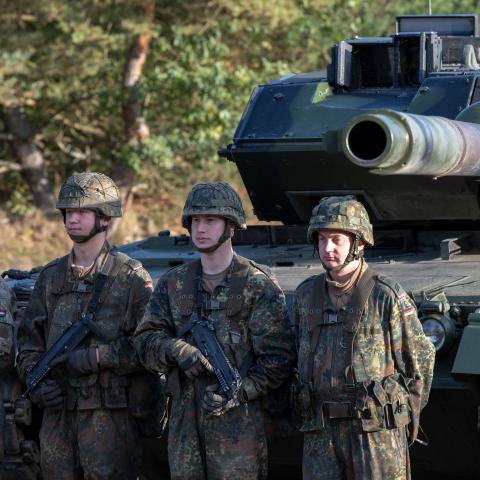 BERGEN, GERMANY - OCTOBER 17: The crew of a main battle tank Leopard 2 waiting for Chancellor Olaf Scholz during a visit at the Bundeswehr army training center in Ostenholz on October 17, 2022 near Hodenhagen, Germany. Scholz has vowed to modernize Germany's armed forces with a special EUR 100 billion budget following Russia's military invasion of Ukraine. (Photo by David Hecker/Getty Images)