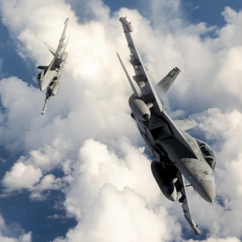 wo U.S. Navy EA-18G Growler aircraft attached to the Electronic Attack Squadron (VAQ) 138 "Yellowjackets", assigned to Carrier Task Force 70, break away from a KC-135 Stratotanker assigned to the 506th Expeditionary Air Refueling Squadron over the Pacific Ocean while flying in support of Exercise Valiant Shield 22 (VS22), June 13 2022. Exercises like VS22 allow forces across the Indo-Pacific the opportunity to integrate Navy, Marine Corps, Army, Air Force, and Space Force to train in precise, lethal, and ov