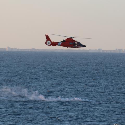 ATLANTIC OCEAN (Feb. 4, 2023) A U.S. Coast Guard helicopter flies over a debris field during recovery efforts of a high-altitude surveillance balloon. The Navy, in joint partnership with the U.S. Coast Guard, are providing multiple units in support of the effort, including ships, aircraft and an Explosive Ordnance Disposal mobile diving and salvage unit. At the direction of the President of the United States and with the full support of the Government of Canada, U.S. fighter aircraft under U.S. Northern Com