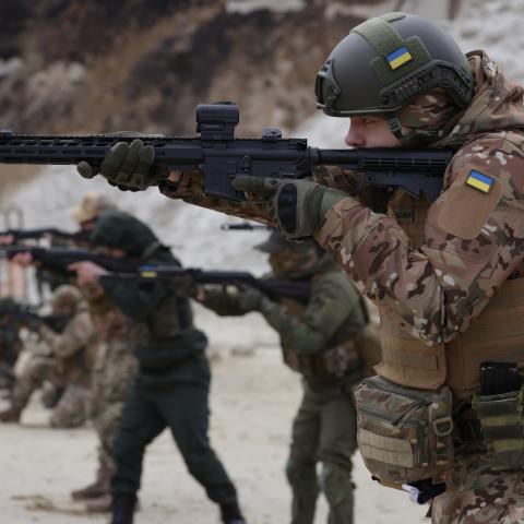 Participants drill shooting positions at a combat training day hosted by a local paramilitary civil formation called TSEL on February 22, 2023, in Lviv, Ukraine. (Sean Gallup/Getty Images)