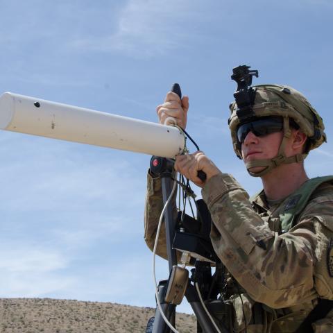Spc. Nathaniel Ortiz, Expeditionary CEMA (Cyber Electromagnetic Activities) Team (ECT), 781st Military Intelligence Battalion, conducts cyberspace operations at the National Training Center at Fort Irwin, California, May 9. (Photo Credit: Mr. Bill Roche (Army Cyber Command))