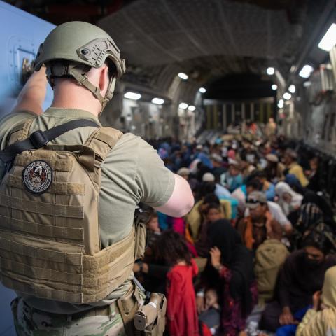 A U.S. Air Force security forces raven, assigned to the 816th Expeditionary Airlift Squadron, maintains security aboard a U.S. Air Force C-17 Globemaster III aircraft in support of the Afghanistan evacuation at Hamid Karzai International Airport (HKIA), Afghanistan, Aug. 24, 2021. (U.S. Air Force photo by Master Sgt. Donald R. Allen)