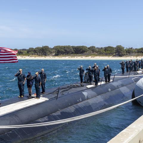 GARDEN ISLAND, Australia – Sailors assigned to the Los Angeles-class fast-attack submarine USS Asheville (SSN 758) salute the national ensign after arriving at Royal Australian Navy HMAS Stirling Naval Base, Feb. 27. Asheville is currently on patrol in support of national security interests in the U.S. 7th Fleet area of operations. (Courtesy photo by Australia Department of Defence)