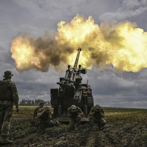 Ukrainian servicemen fire a Caesar self-propelled howitzer toward Russian positions at a front line in Donbas, Ukraine, on June 15, 2022. (Aris Messinis/AFP via Getty Images)