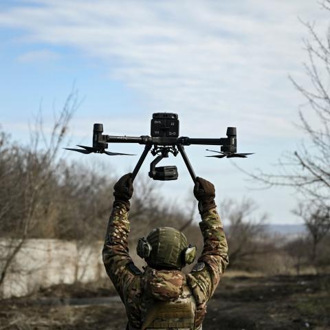 A Ukrainian serviceman flies a drone to spot Russian positions near the city of Bakhmut, in the region of Donbas, on March 5, 2023. (Photo by Aris Messinis / AFP) (Photo by ARIS MESSINIS/AFP via Getty Images)