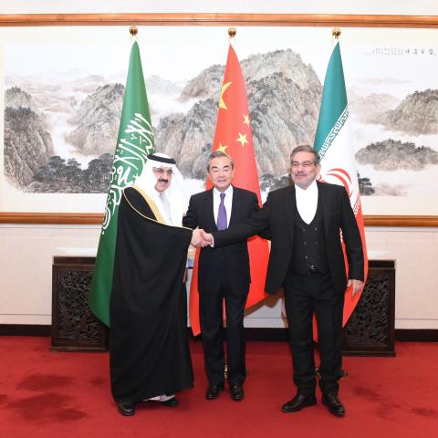 Saudi Minister of State Musaad bin Mohammed Al-Aiban, CCP Politburo member Wang Yi, and Iranian Secretary of the Supreme National Security Council Ali Shamkhani in Beijing, on March 10, 2023. (Luo Xiaoguang/Xinhua via Getty Images)