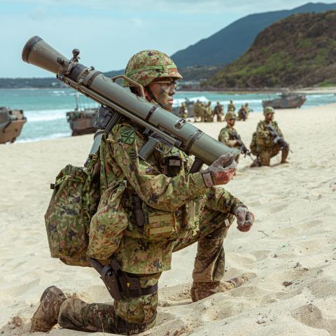 A soldier with the 1st Amphibious Rapid Deployment Regiment, Japan Ground Self-Defense Force provides security during a bilateral amphibious assault exercise with U.S. Marines from Battalion Landing Team 1/4, 31st Marine Expiditionay Unit, at Tokunoshima, Japan, March 3, 2023. The bilateral amphibious assault exercise allowed Marines and JGSDF soldiers to simultaneously secure austere terrain. during Iron Fist 23. Iron Fist is an annual bi-lateral exercise designed to increase interoperability and strengthe