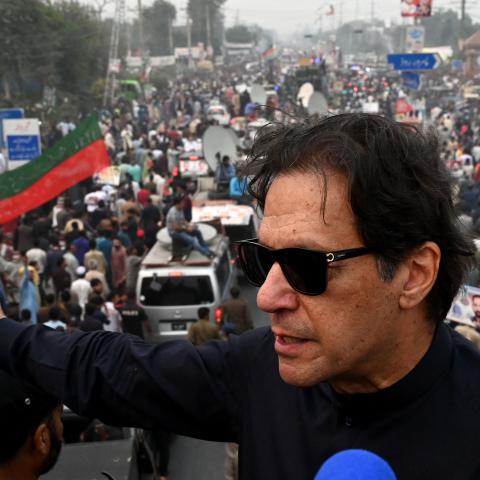Pakistan's former prime minister Imran Khan speaks while taking part in an anti-government march in Gujranwala, Pakistan, on November 1, 2022, two days before he was shot in the foot at another rally. (Arif Ali/AFP via Getty Images)
