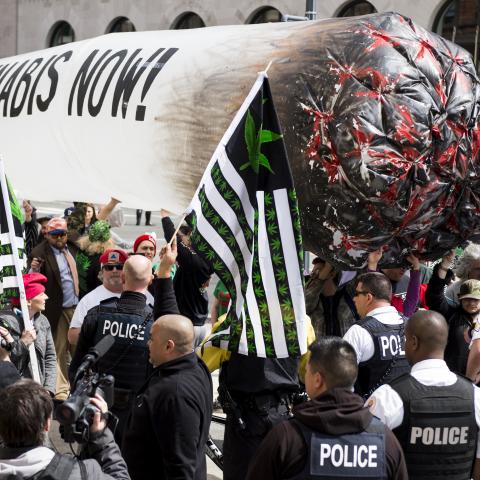  STATES - APRIL 2: Secret Service block pro-marijuana protesters from carrying their 51-foot inflated marijuana joint down Pennsylvania Avenue in front of the White House on Saturday, April 2, 2016. The DCMJ, DC Cannabis Campaign, organized the protest at the White House to call on President Barack Obama to reschedule cannabis. (Photo By Bill Clark/CQ Roll Call)