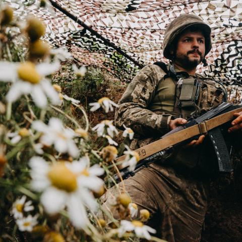 A Ukrainian soldier of the 24th Separate Mechanized Brigade stands outside the town of New York on the front lines of Russia's war against Ukraine on July 28, 2023. (Wojciech Grzedzinski/Anadolu Agency via Getty Images)