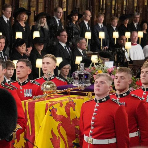 The coffin of Queen Elizabeth II is carried by Pall bearers from the Queen's Company at St George's Chapel, Windsor Castle, on September 19, 2022, in Windsor, England. (Jonathan Brady via Getty Images)