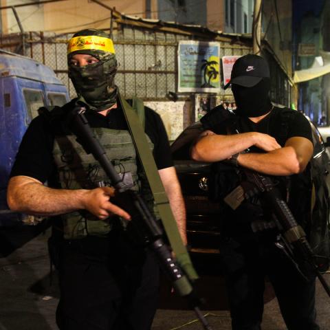 Palestinian gunmen from the Fatah movement carry their weapons in support of the Palestinian Authority headed by President Mahmoud Abbas during a military parade in the Askar refugee camp in the West Bank city of Nablus. (Nasser Ishtayeh/SOPA Images/LightRocket via Getty Images)