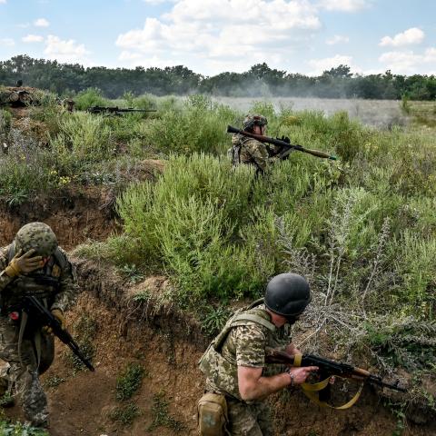 Servicemen of the 128th Separate Brigade of Territorial Defense Forces practice storming enemy positions during a tactical drill in the Zaporizhzhia direction, southeastern Ukraine. (Ukrinform/NurPhoto via Getty Images)