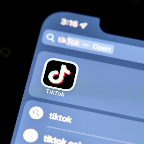 The logo of Chinese online social media and video hosting service TikTok is displayed on a smartphone screen (Alpha Photo via Flickr)