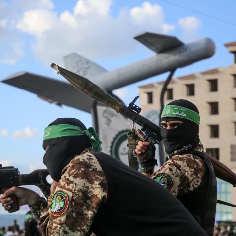 Members of the Ezzedine al-Qassam Brigades attend a memorial to a model of Shehab drone during a rally in Gaza City on September 21, 2022. (Majdi Fathi/NurPhoto via Getty Images)