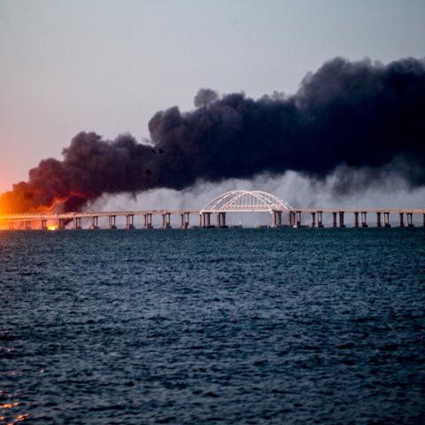 A fire on the Kerch Bridge following a truck bomb attack on October 8, 2022. (Photo by Vera Katkova/Anadolu Agency via Getty Images)