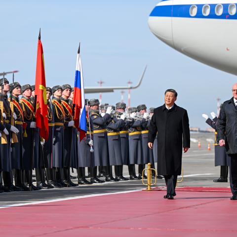 Chinese President Xi Jinping inspects the honor guard of the three services and watches the march-past at the Moscow Vnukovo Airport in Moscow, Russia, on March 20, 2023. (Xie Huanchi/Xinhua via Getty Images)