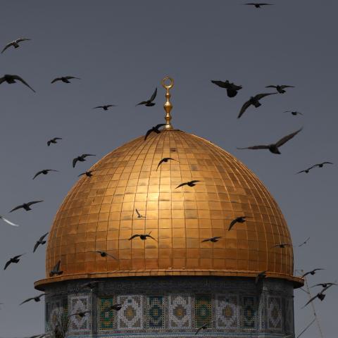 Birds fly in front of the Dome of the Rock shrine at the Al-Aqsa mosque compound in Jerusalem on March 24, 2023. (Ahmad Gharabli/AFP via Getty Images)